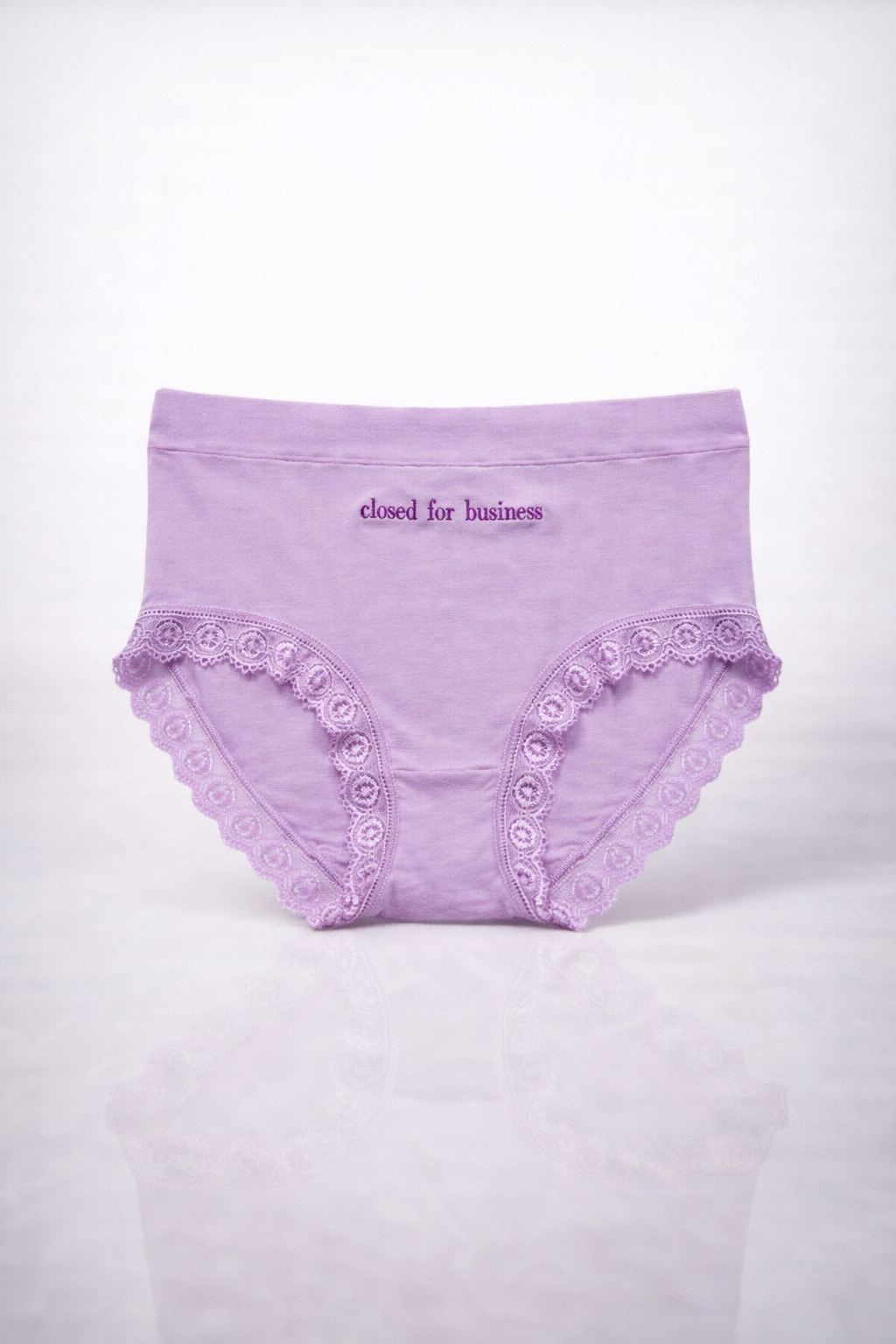 Purple underwear with lace details on a white background