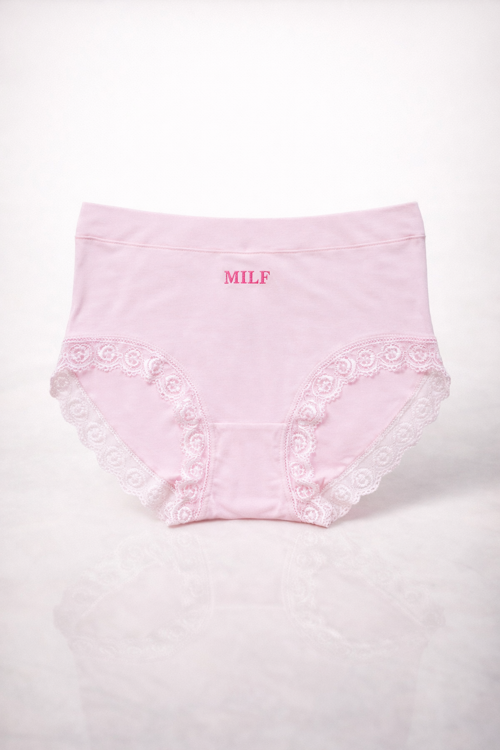Pink lace underwear with ' MILF' text on a white background
