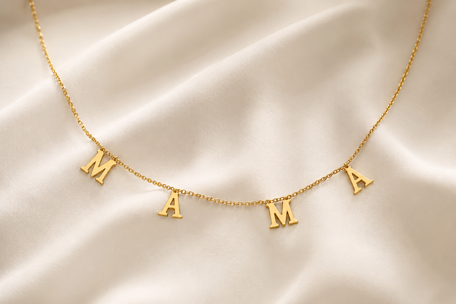 Mamacita Collective 18k gold-plated MAMA necklace, shown against a plain background.