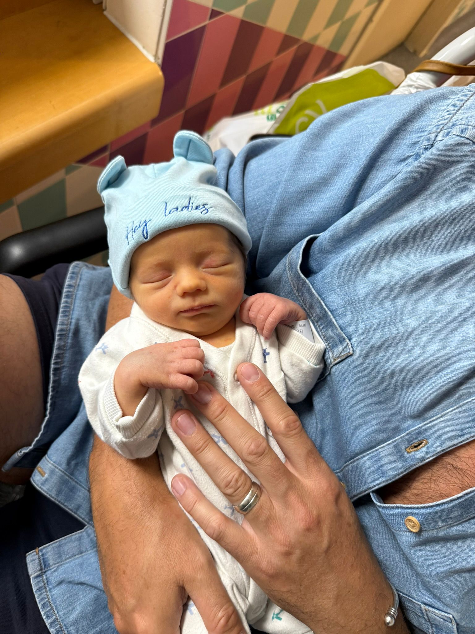 Mamacita Collective Soft Newborn Hat in Blue worn by a baby.
