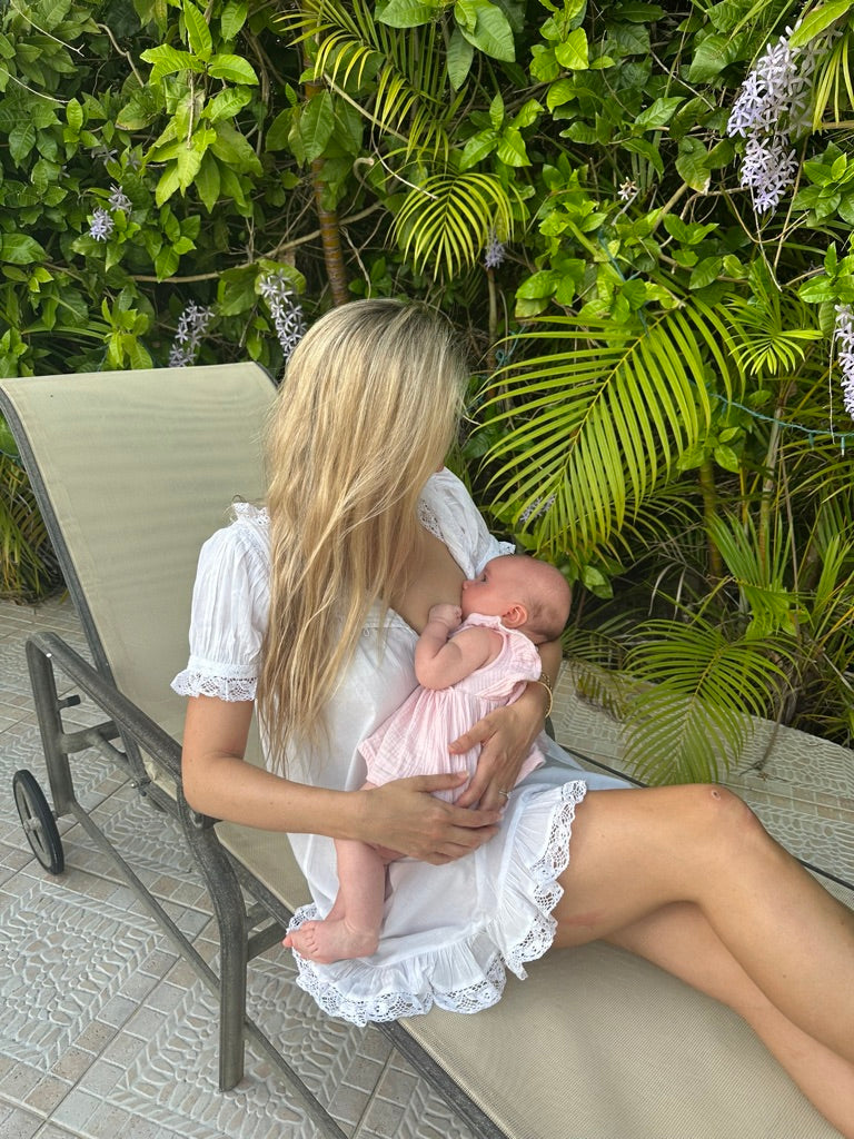 Gigi lace nightdress worn outdoors while holding a baby.