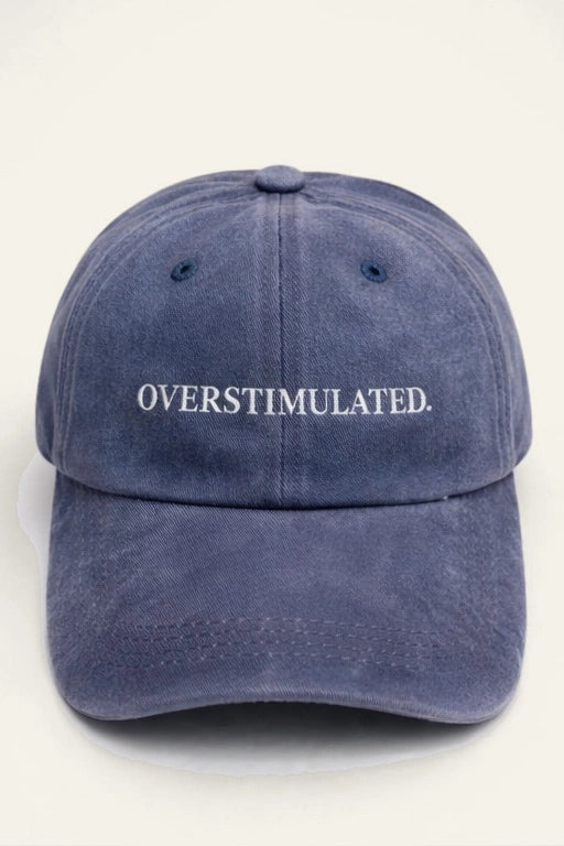 Close-up of the Overstimulated. Cap's embroidered slogan detail.