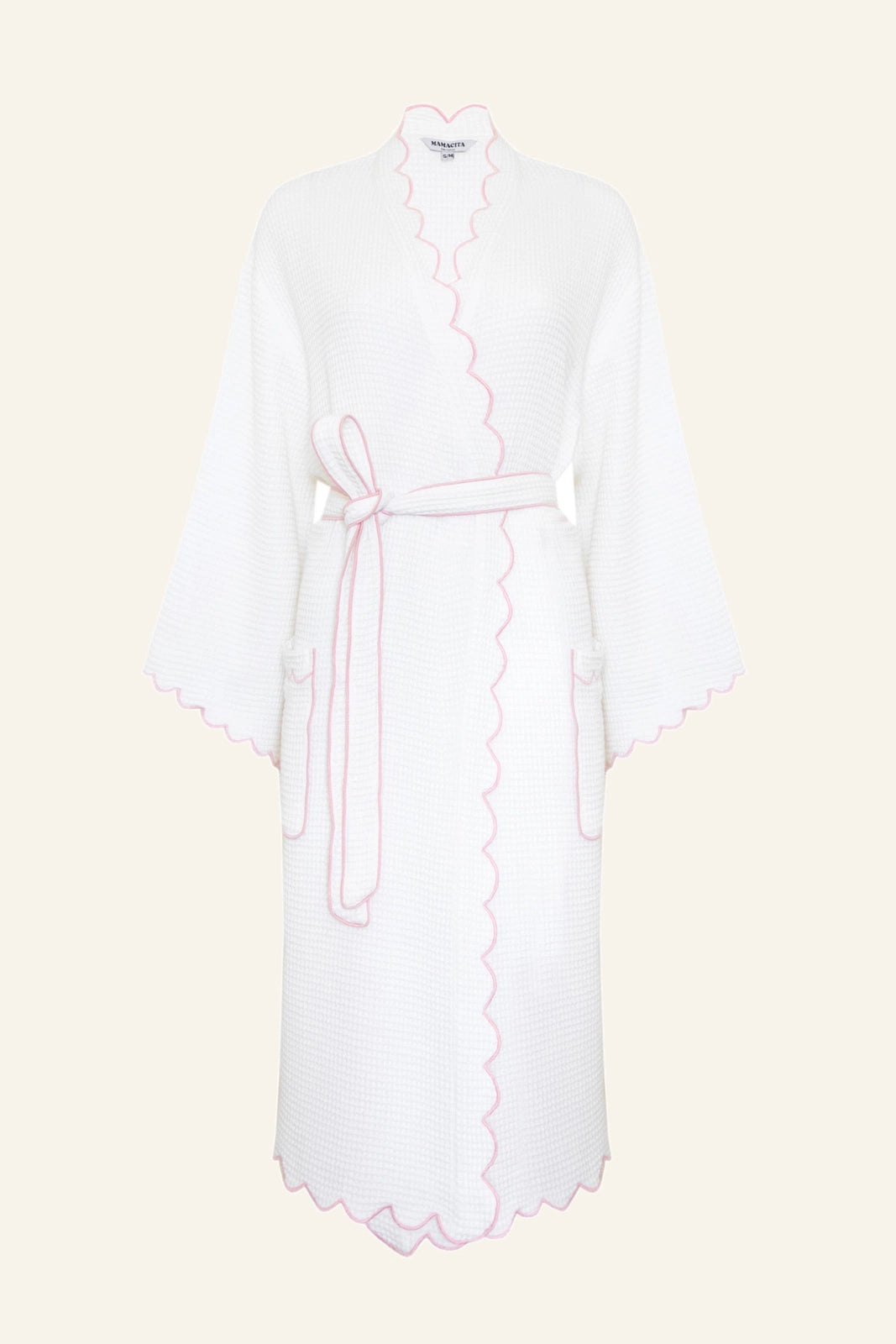 A white scalloped waffle robe with flared 7/8 sleeves and rose pink embroidered edges, tied with a sash at the waist.