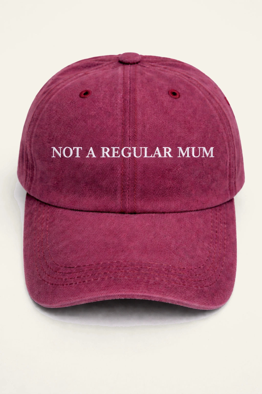 The Not a Regular Mum Cap, washed cotton cap with white embroidered 'NOT A REGULAR MUM.' slogan.