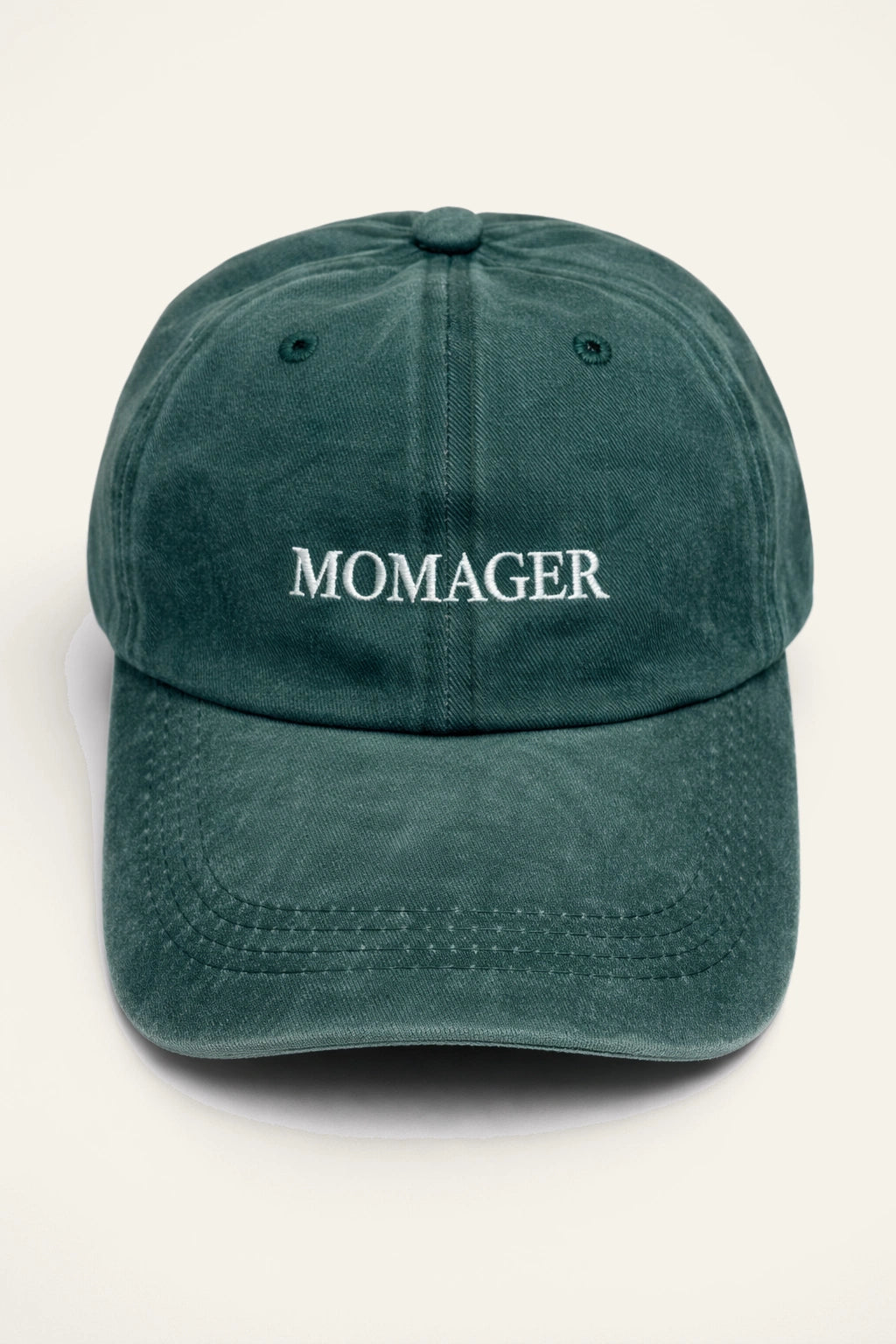 Close-up of the Momager Cap's embroidered slogan detail.