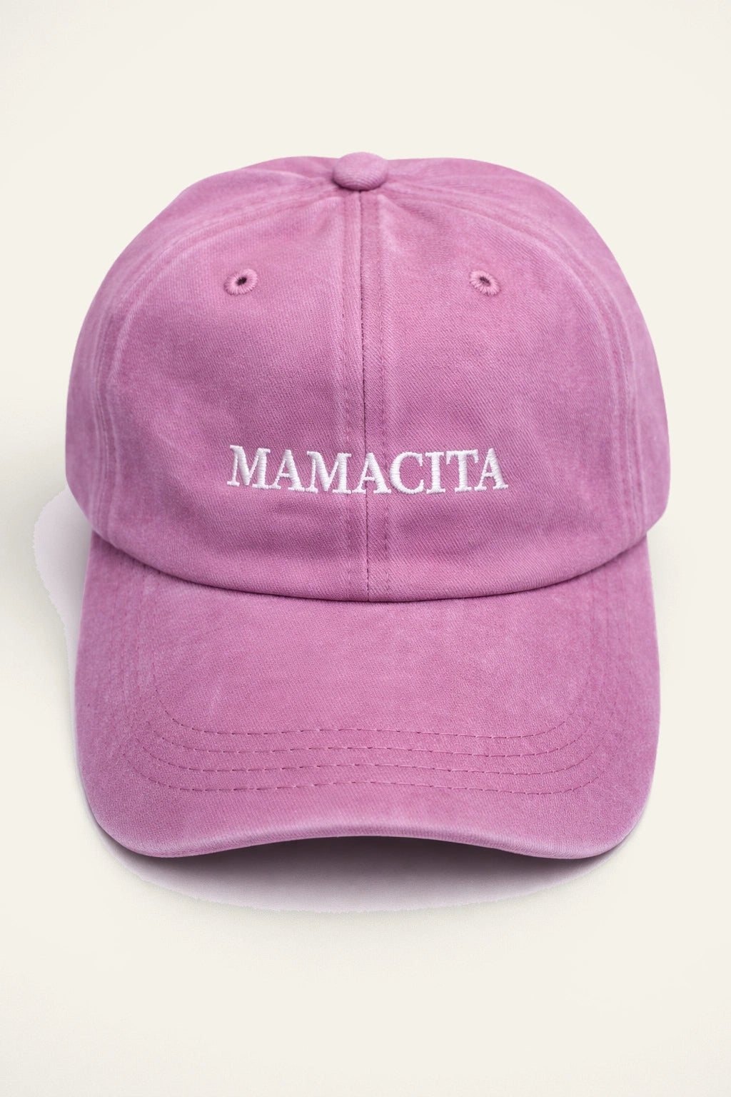 The Mamacita Cap shown from a side angle, highlighting the adjustable back fastening.