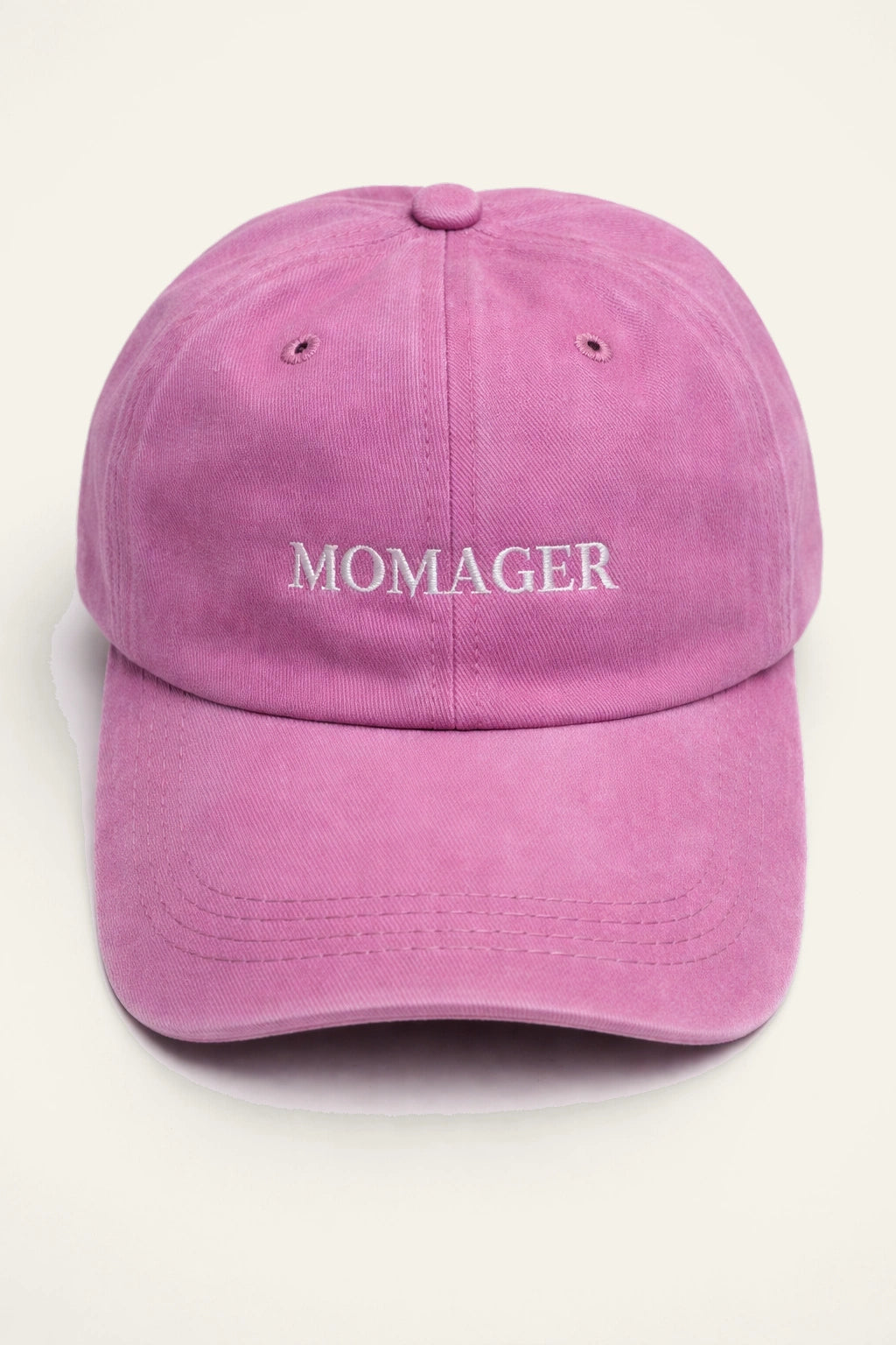 The Momager Cap styled on a model.
