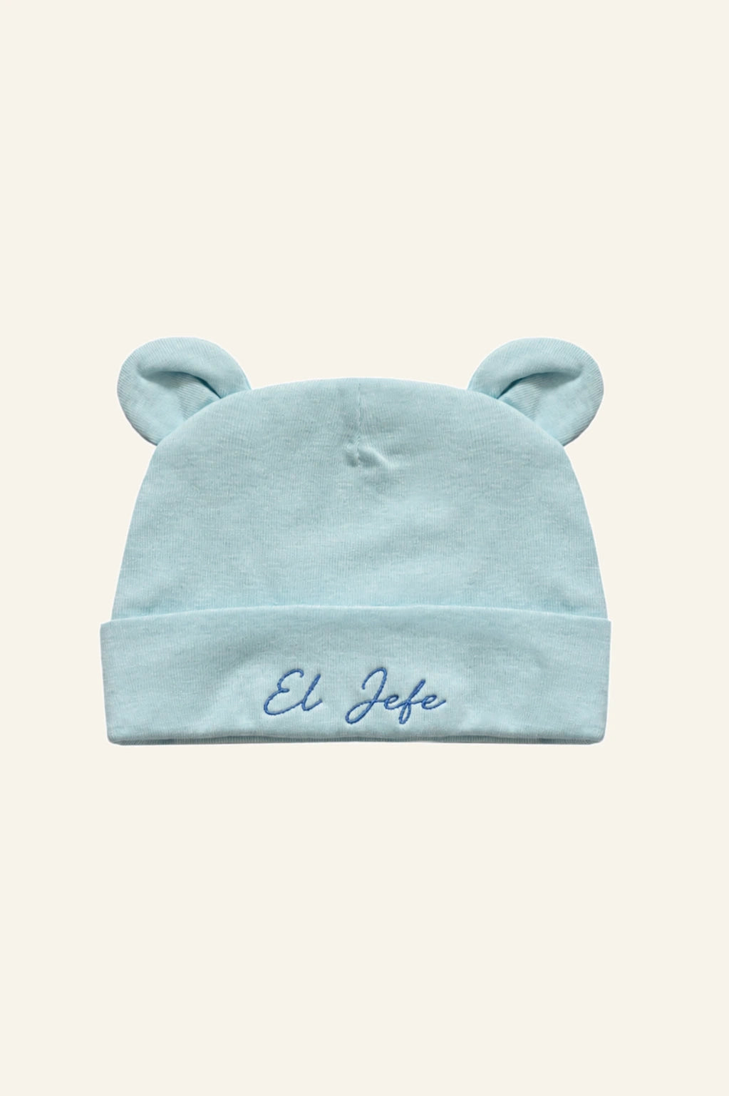 Mamacita Collective Soft Newborn Hat in Blue, shown against a plain background.