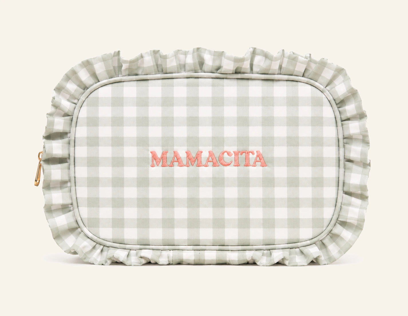 A rectangular cosmetic pouch with rounded corners, featuring a sage green and white gingham check pattern, a ruffled trim, and the brand name 'MAMACITA' embroidered in coral pink across the center.