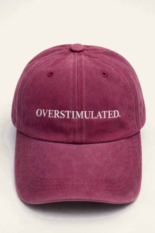 The Overstimulated. Cap, washed cotton cap with white embroidered 'OVERSTIMULATED.' slogan.