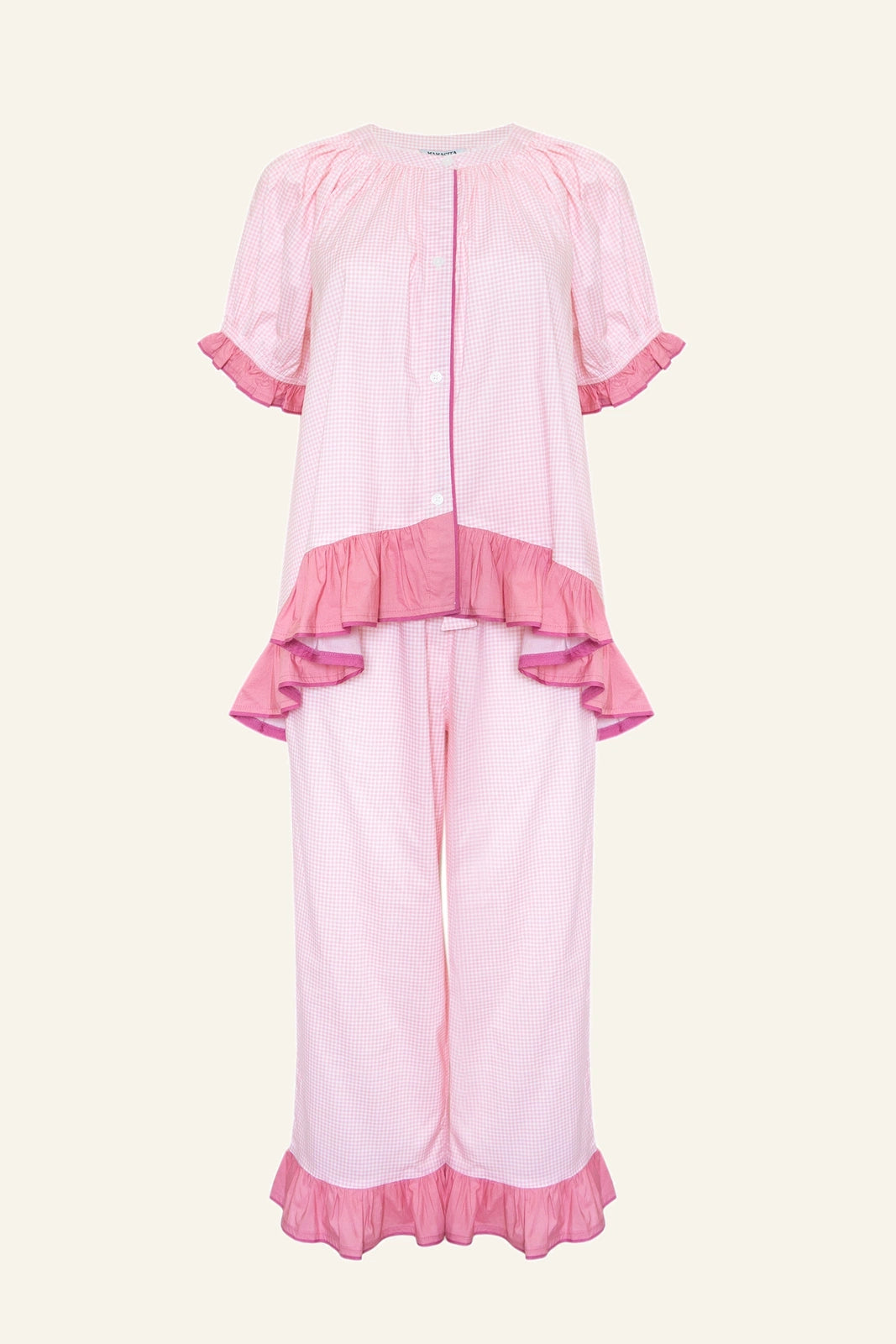 The Bonnie Ruffle Sleep Set in Rose Gingham laid flat, showing the ruffled trim and gingham check print.
